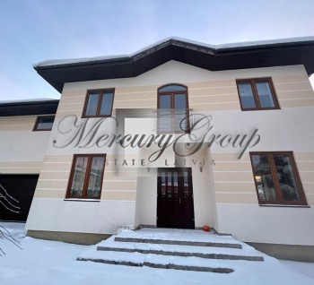 Private house with a large landscaped area.Located in the green closed village.
