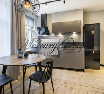 A stylish and modern apartment for sale in a renovated building in the center of Riga.