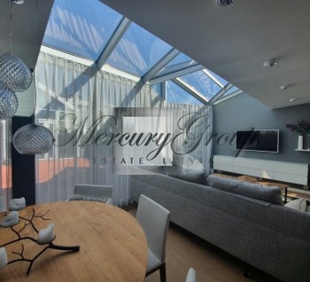 We offer to rent a spacious, stylish penthouse apartment