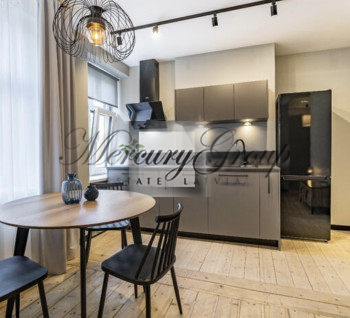 A stylish and modern apartment for sale in a renovated building in the center of Riga.