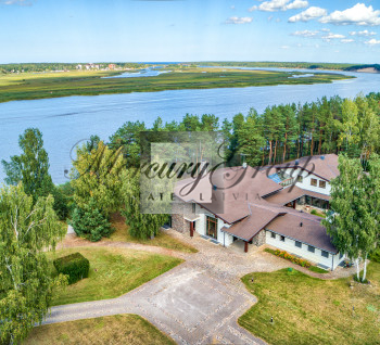 Luxury villa with a swimming pool and river views in Priedaine